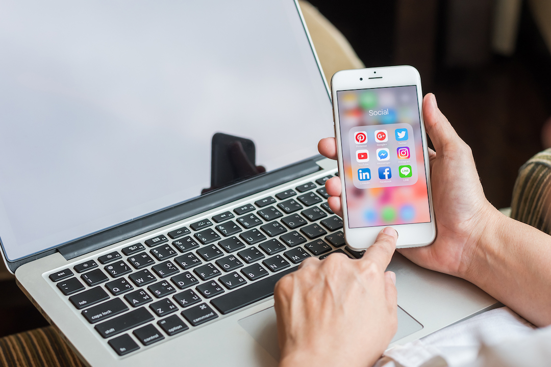 Social media app icons on Iphone 7 screen smartphone with mobile internet network computer technology for people digital 4.0 lifestyle.