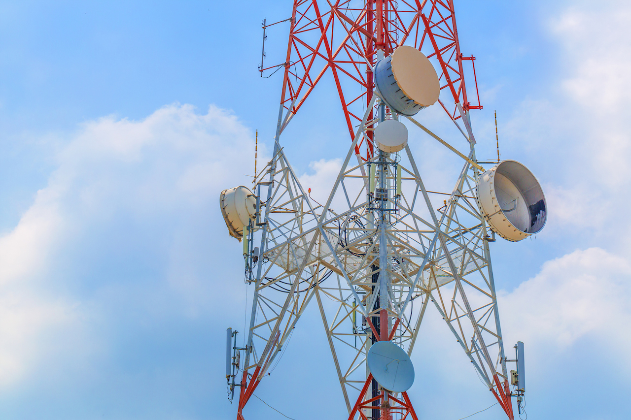 Large communication towers on a bright day
