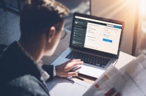 Closeup,View,Of,Banking,Finance,Analyst,In,Eyeglasses,Working,At