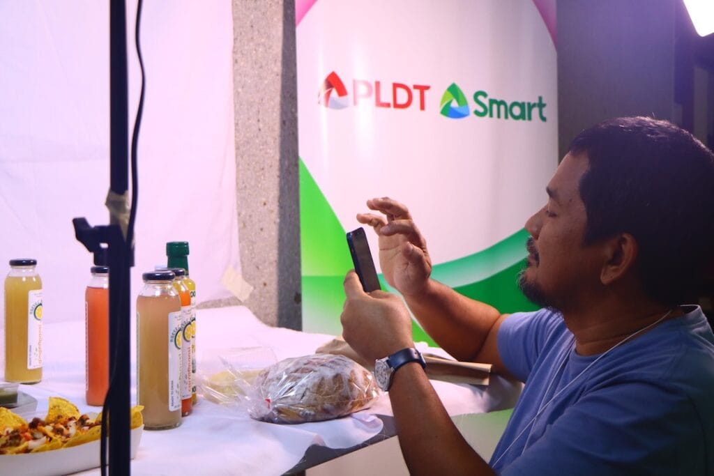 Charlie M. Montero Jr., owner of Nueva C Calamansi and Charibelle's Pastries taking product photos